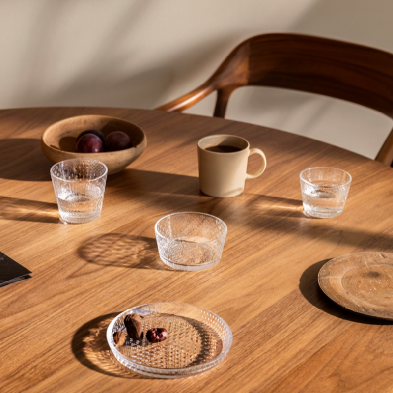 Iittala TUNDRA (1970) collection on an oak dining table