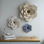Lovi DECOR FLOWERs in translucent white, flax blue and natural wood color on the wall 