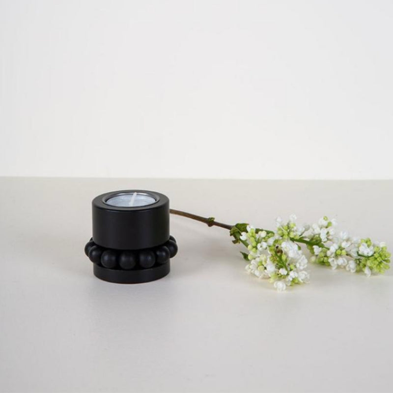 Aarikka Black PRINSESSA Tea Light Candle Holder (2" / 5 cm) on the table