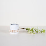 Aarikka White PRINSESSA Tea Light Candle Holder (2" / 5 cm) on the table