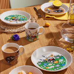Arabia MOOMIN LITTLE MY and MEADOW and STINKY in ACTION plates and mugs on a breakfast table