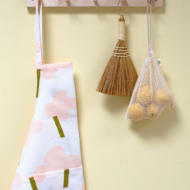 Kauniste ONNI Pink Linen - Cotton Apron hanging on the wall