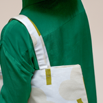 Kauniste ONNI Linen-Cotton Tote Bag in light grey on a shoulder of a model